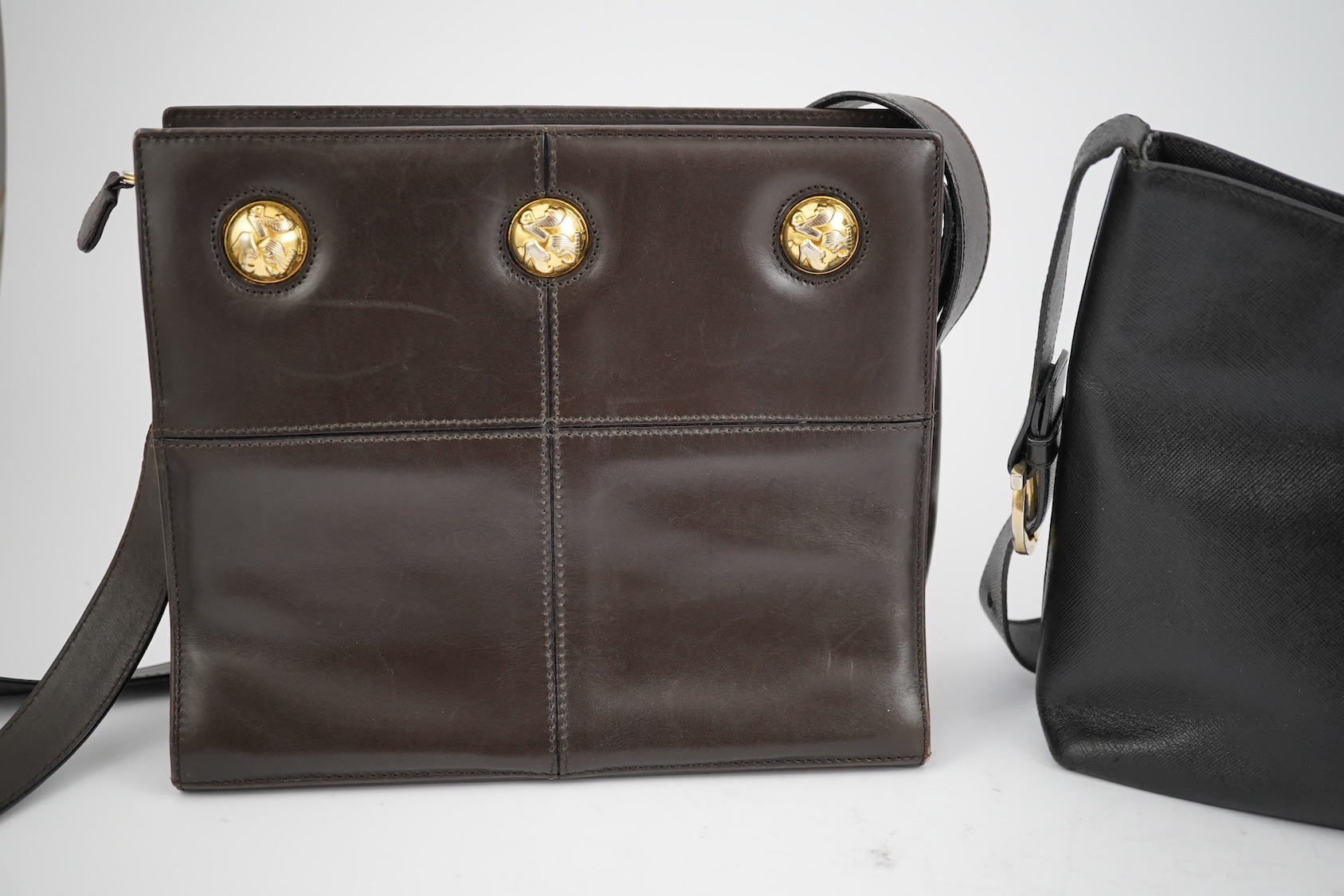 A Salvatore Ferragamo brown leather shoulder bag, and two other handbags